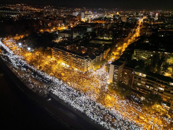 A drone view shows people flashing mobile phone lights during a 16 minutes of silence, on the first anniversary of the fatal November 2024 Novi Sad railway station canopy collapse, which killed 16 people, triggering nationwide accusations of widespread corruption and negligence, in Novi Sad, Serbia.