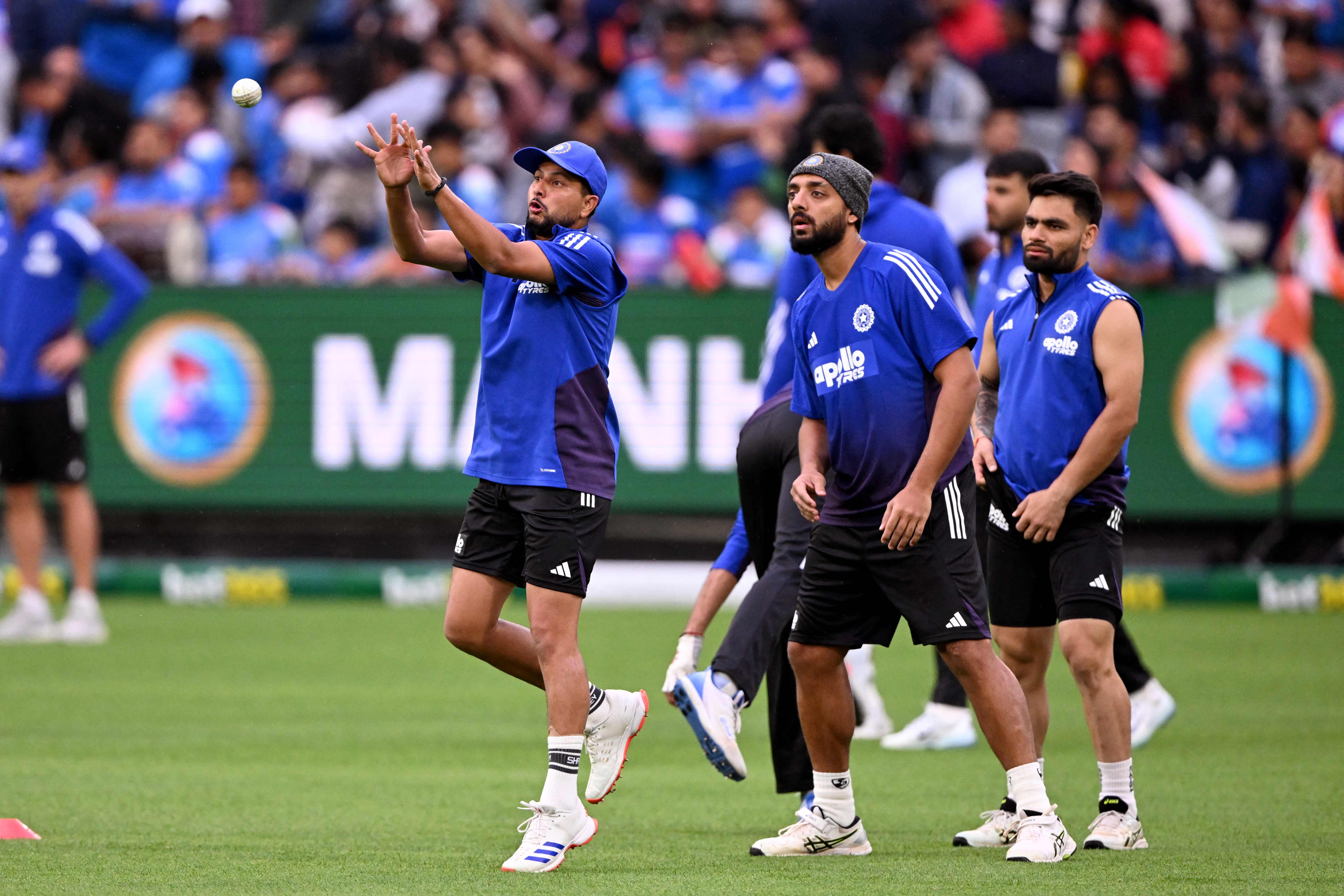 Indian players being put through session of catching. AFP