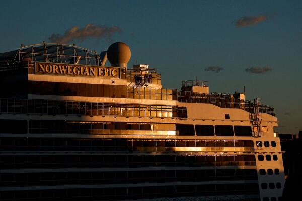 Passengers walk on the NCL (Norwegian Cruise Line) cruise liner "Norwegian Epic" in Valletta's Grand Harbour, as seen from Floriana, Malta.