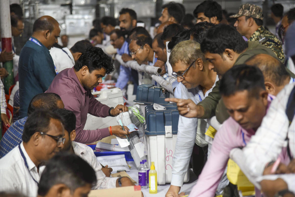 Polling officials submit the EVMs and VVPATs at a collection centre after the first phase of the Bihar Assembly elections, in Patna.Credit: PTI