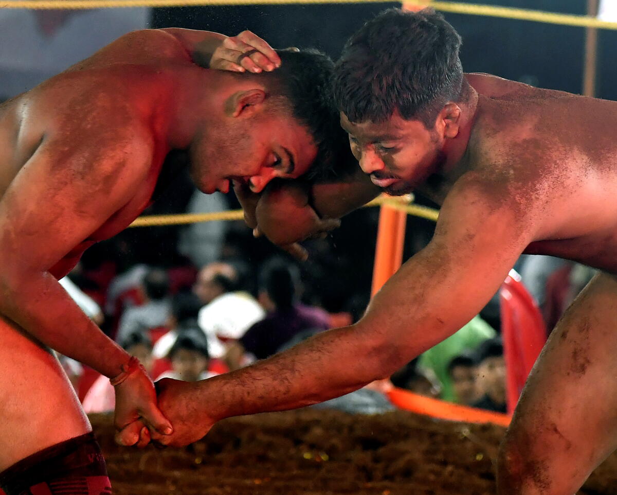 Wrestlers during a bout at the 'Khasdar Krida Mahotsav 2025', in Mumbai, Saturday. Credit: PTI