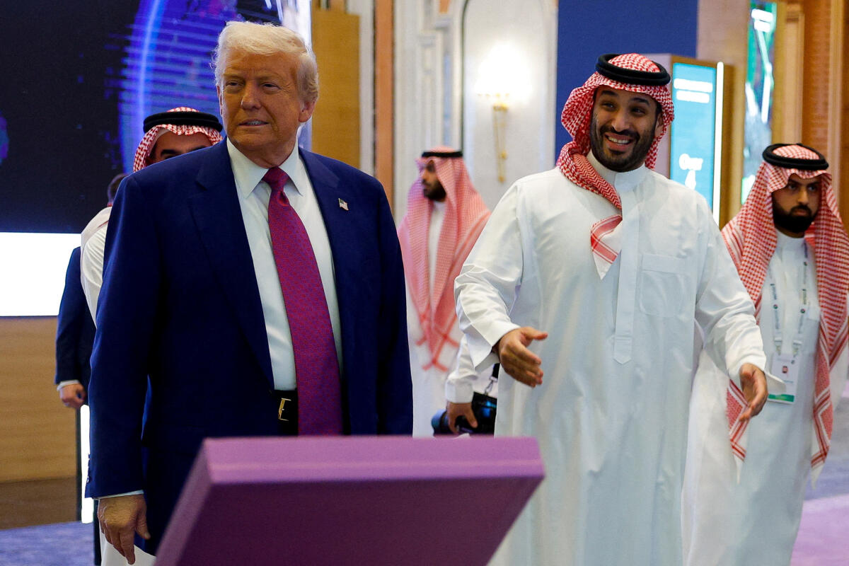 Saudi Crown Prince Mohammed Bin Salman reacts next to U.S. President Donald Trump during the Saudi-U.S. Investment Forum, in Riyadh, Saudi Arabia.Credit:Reuters 