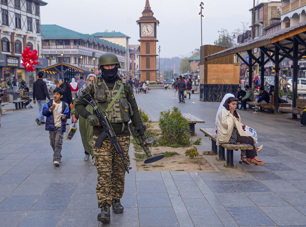 A CRPF official patrols the market area, amid tight security in the aftermath of a high-intensity blast in a car near Delhi’s Red Fort on Monday evening that killed at least 12 persons, at Lal Chowk, in Srinagar.