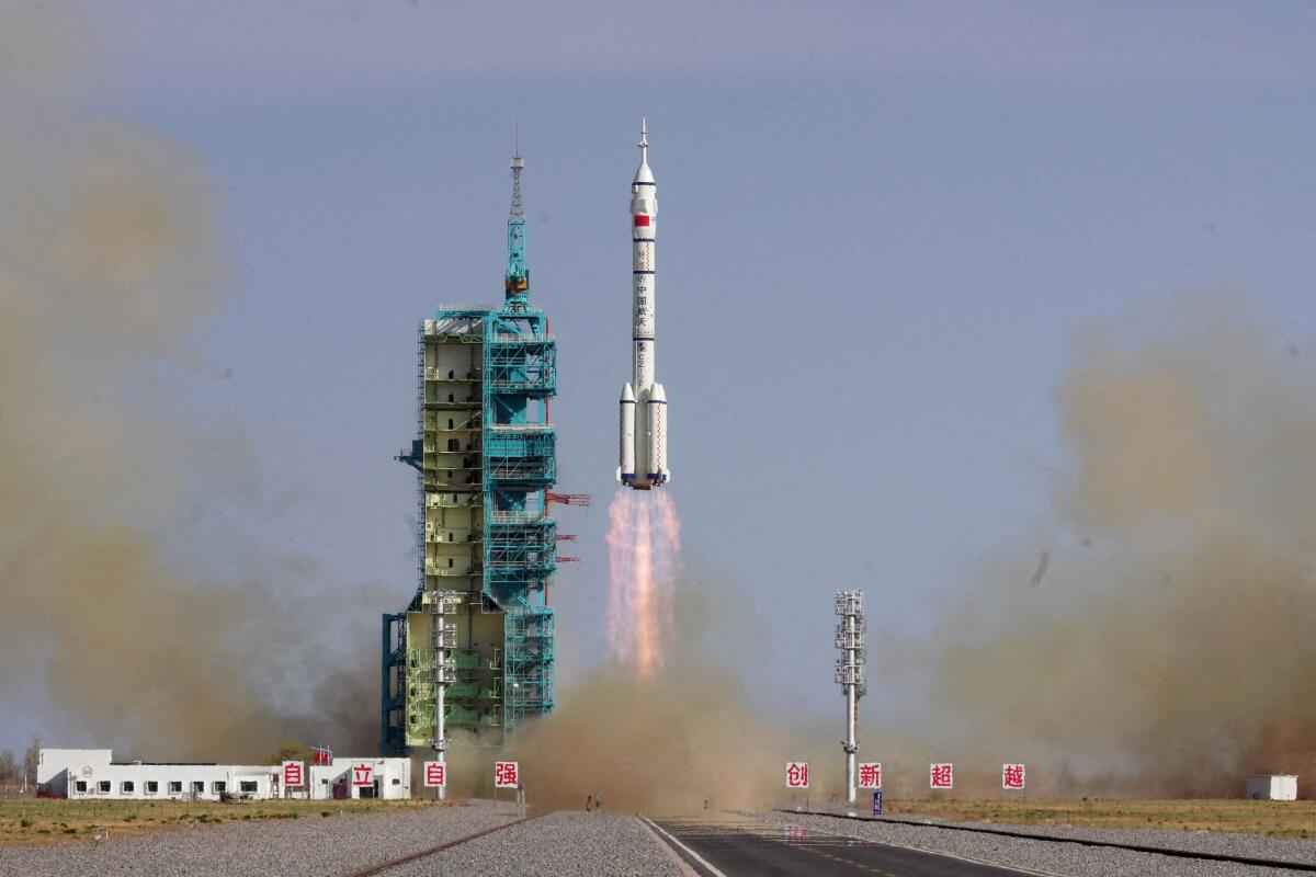 A Long March-2F rocket carrying the Shenzhou-20 spacecraft takes off from the Jiuquan Satellite Launch Center for a crewed mission to China's Tiangong space station, near Jiuquan, Gansu province, China.