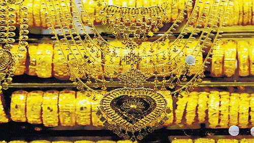 Gold, silver futures lose momentum on weak global cues, fading rate cut hopes