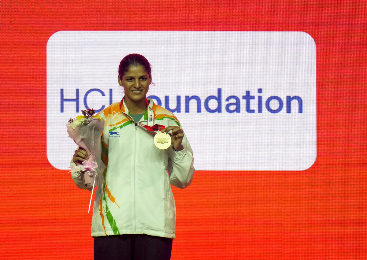 India's Jaismine Lamboria, gold medallist in the women’s 57kg category, poses during the felicitation ceremony at the World Boxing Cup Finals 2025, in Greater Noida, Uttar Pradesh.