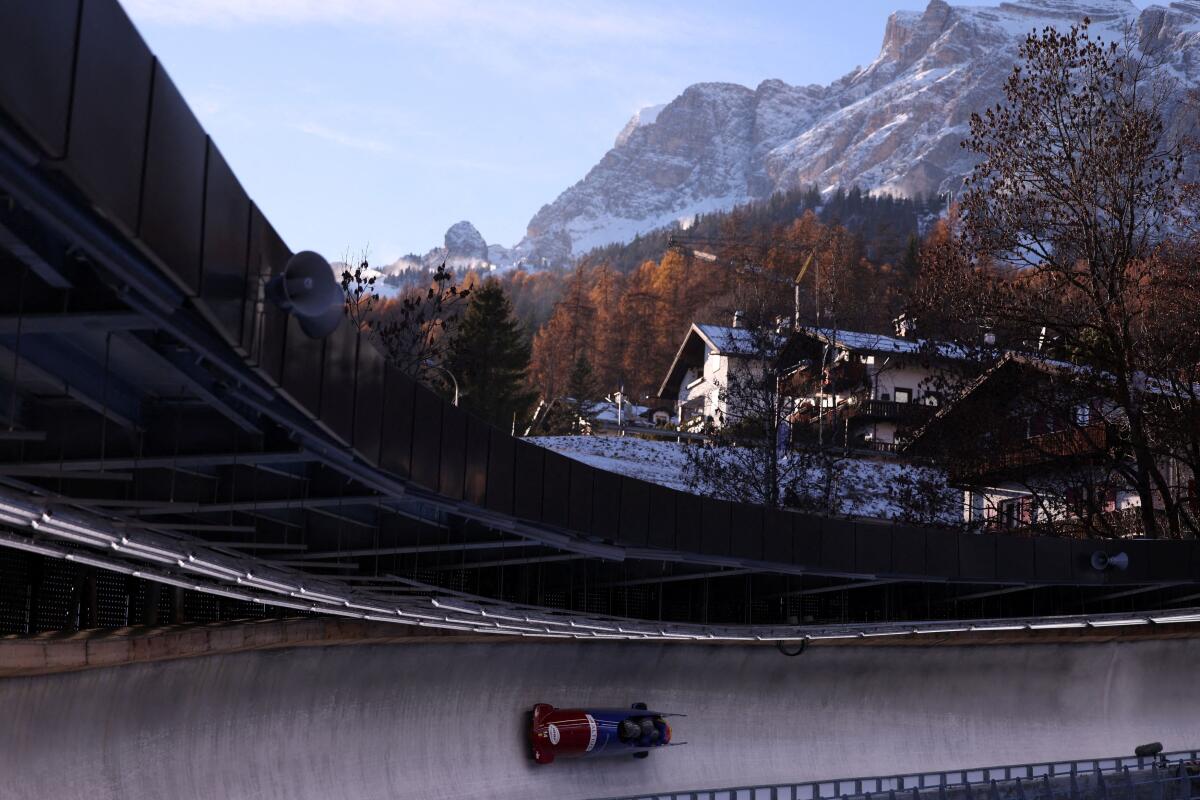 Romania's Mihai Cristian Tentea, Constantin Dinescu, Mihai Daniel Pacioianu, and Andrei Nica in action during heat 2