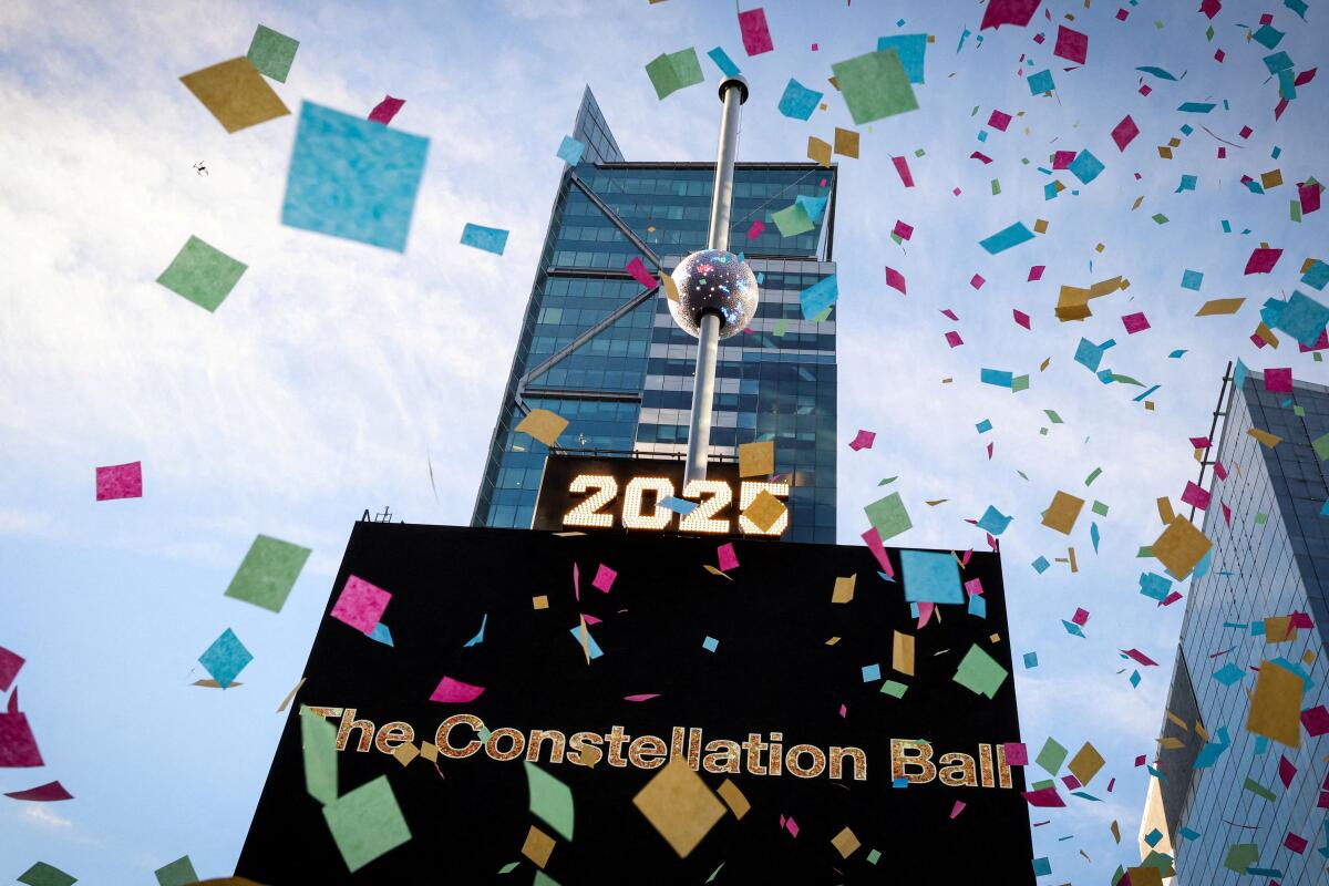 A newly created New Year's eve ball adorned with 5,280 Waterford crystals is raised for the first time above One Times Square ahead of the New Year's Eve ball drop in New York City, U.S., November 24, 2025.