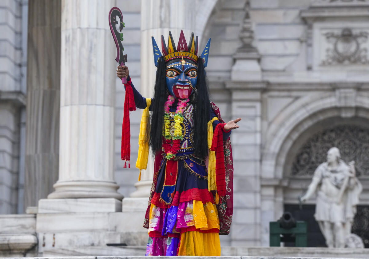 An artist performs the 'Gomira' mask dance as part of World Heritage Week 2025 celebrations, at Victoria Memorial, in Kolkata, Tuesday, Nov. 25, 2025.