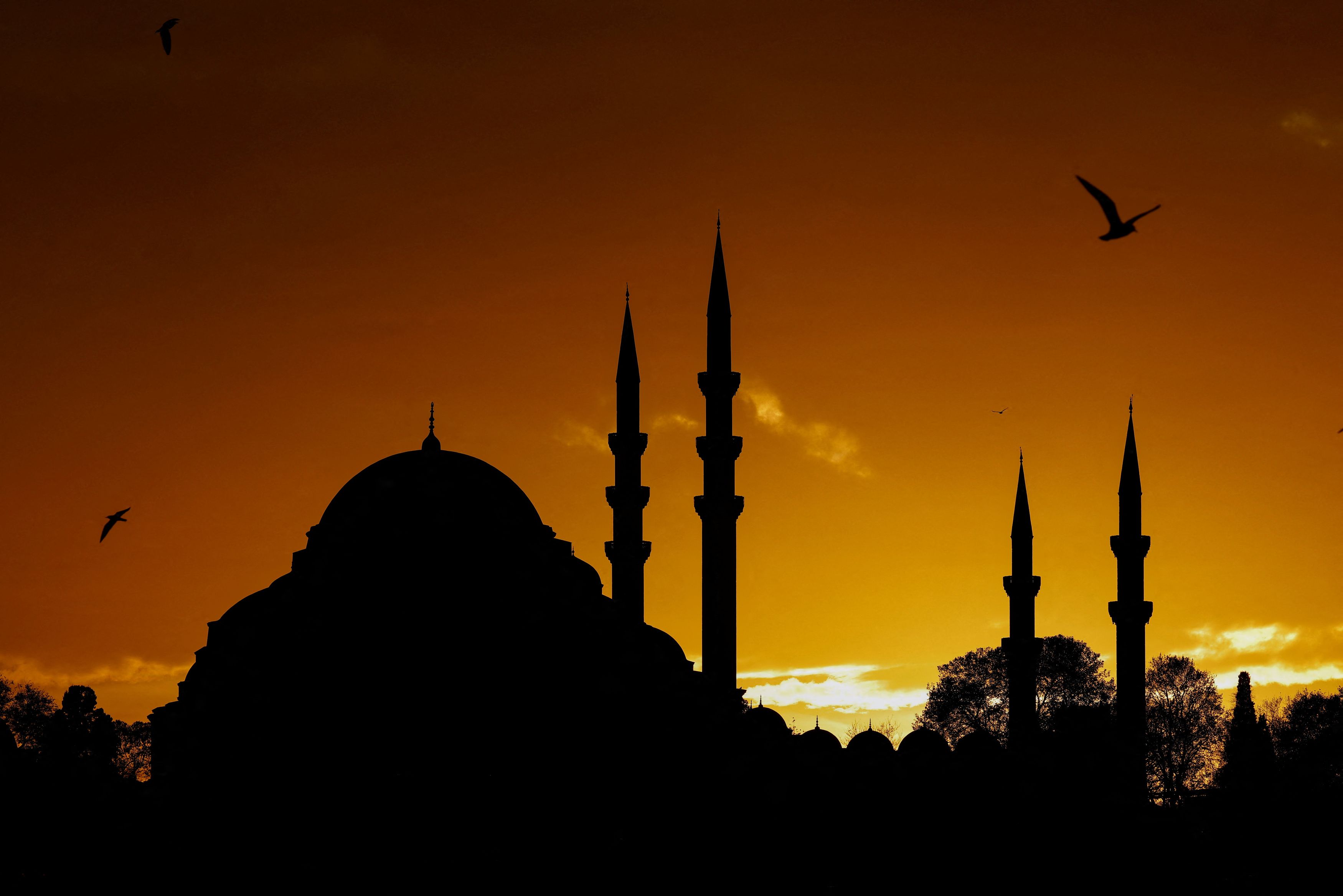 The sun sets over the Suleymaniye Mosque in Istanbul.
