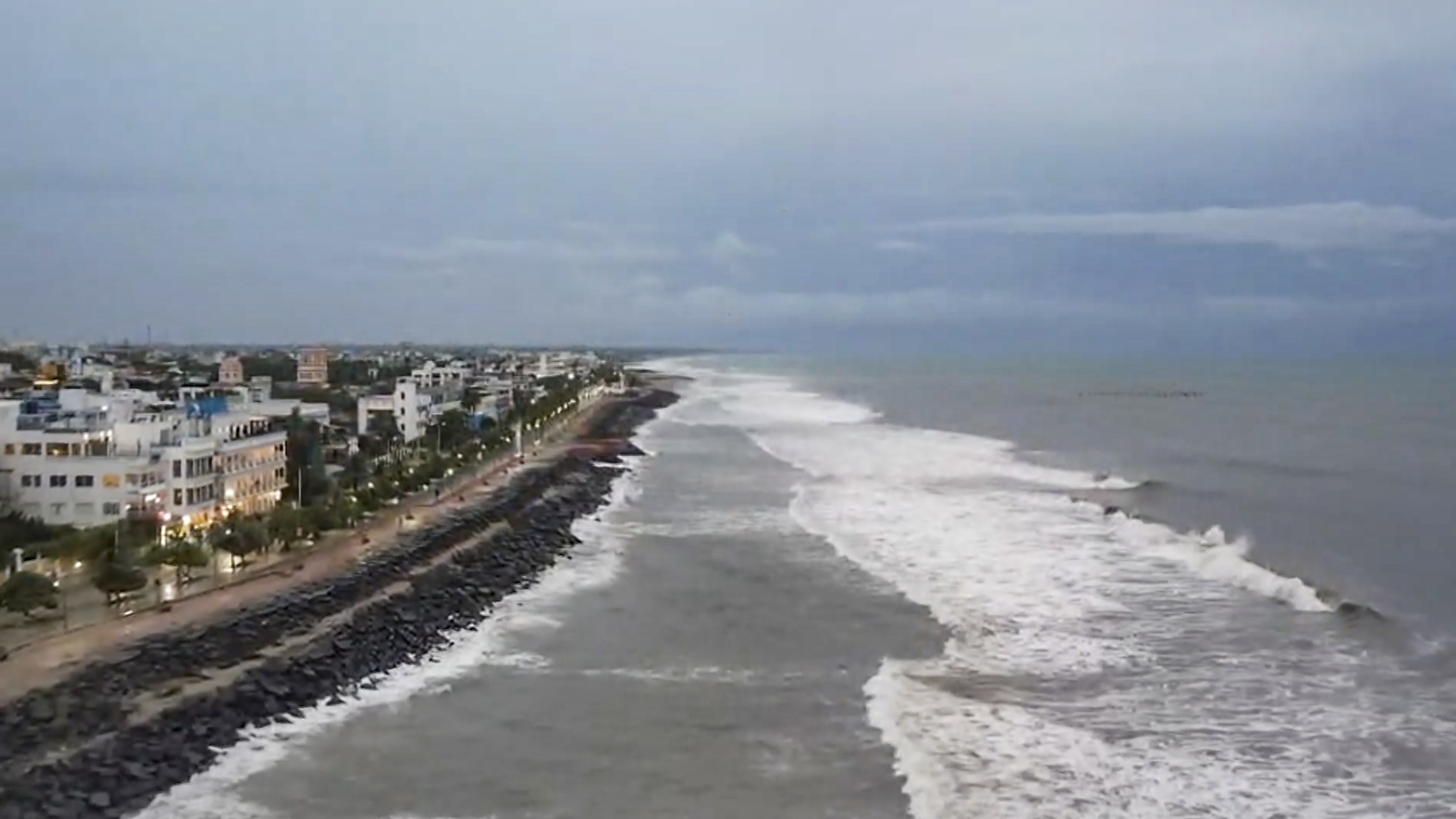  An aerial view of waves crashing at the shore as cyclone Ditwah approaches, in Puducherry.