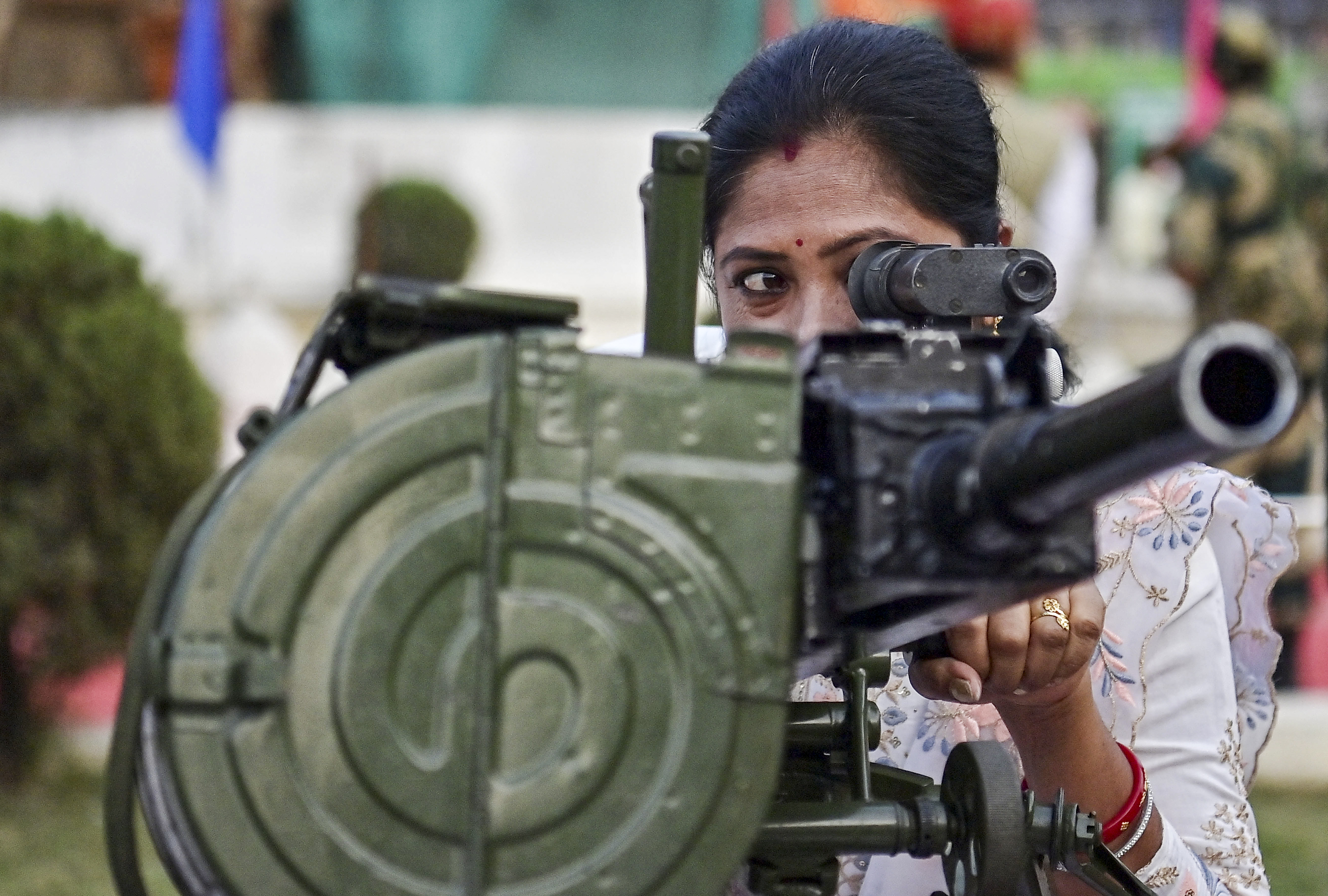 A visitor checks a weapon during an exhibition by Border Security Force (BSF), in Agartala.