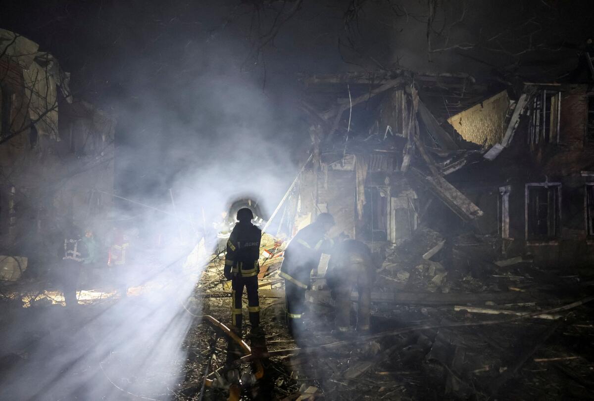 Rescuers work at the site of apartment buildings hit by a Russian air strike, amid Russia's attack on Ukraine, in Sloviansk, Ukraine