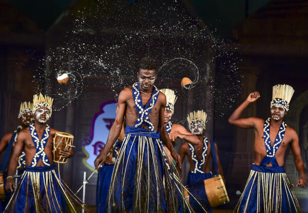 rtists from Gujarat perform 'Siddhi Dhamal', a traditional dance during the National Craft Fair, in Prayagraj.