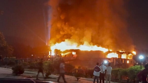 Smoke and flames billow after a fire broke out at a nightclub, in North Goa, after midnight on Sunday.