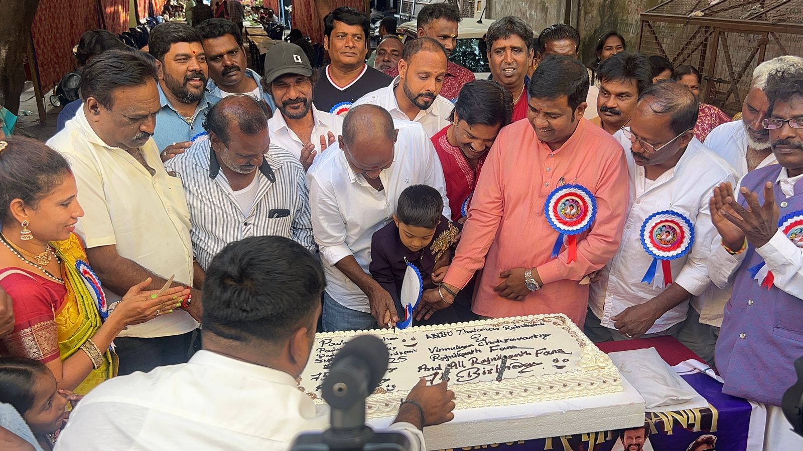 Fans celebrate by cutting a 20-kg cake near Lalbagh on Friday. PHOTO: Fans