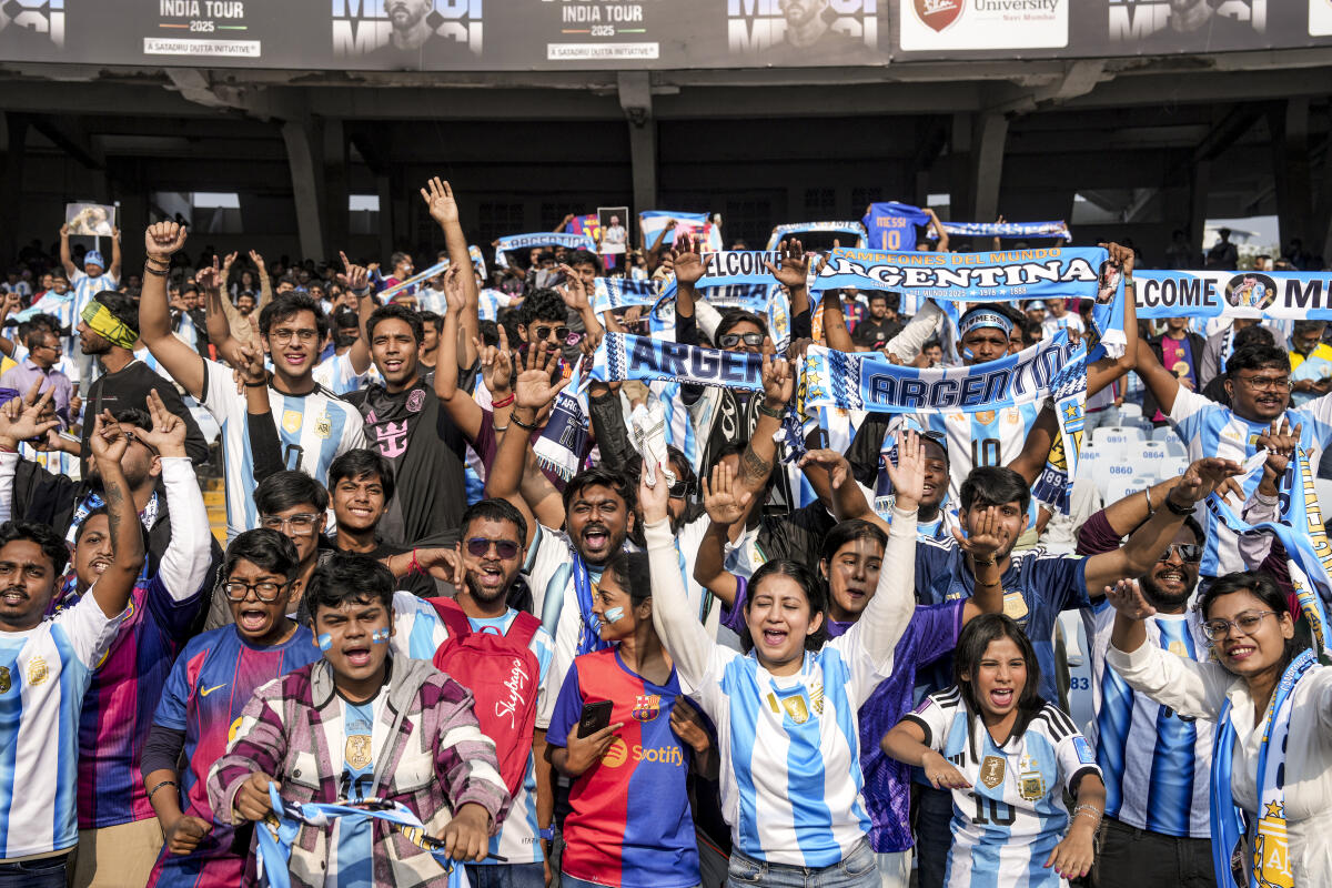 Fans of Argentine footballer Lionel Messi gather to attend an event as part of the 'G.O.A.T. India Tour 2025', at Vivekananda Yuba Bharati Krirangan (VYBK).