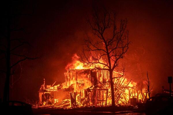 Flames engulf a structure as the Eaton Fire burns in Pasadena, California, US.
