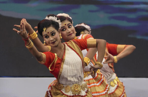 Artists perform traditional dance during the 'Byabasayi Sammelan 2025', in Kolkata.