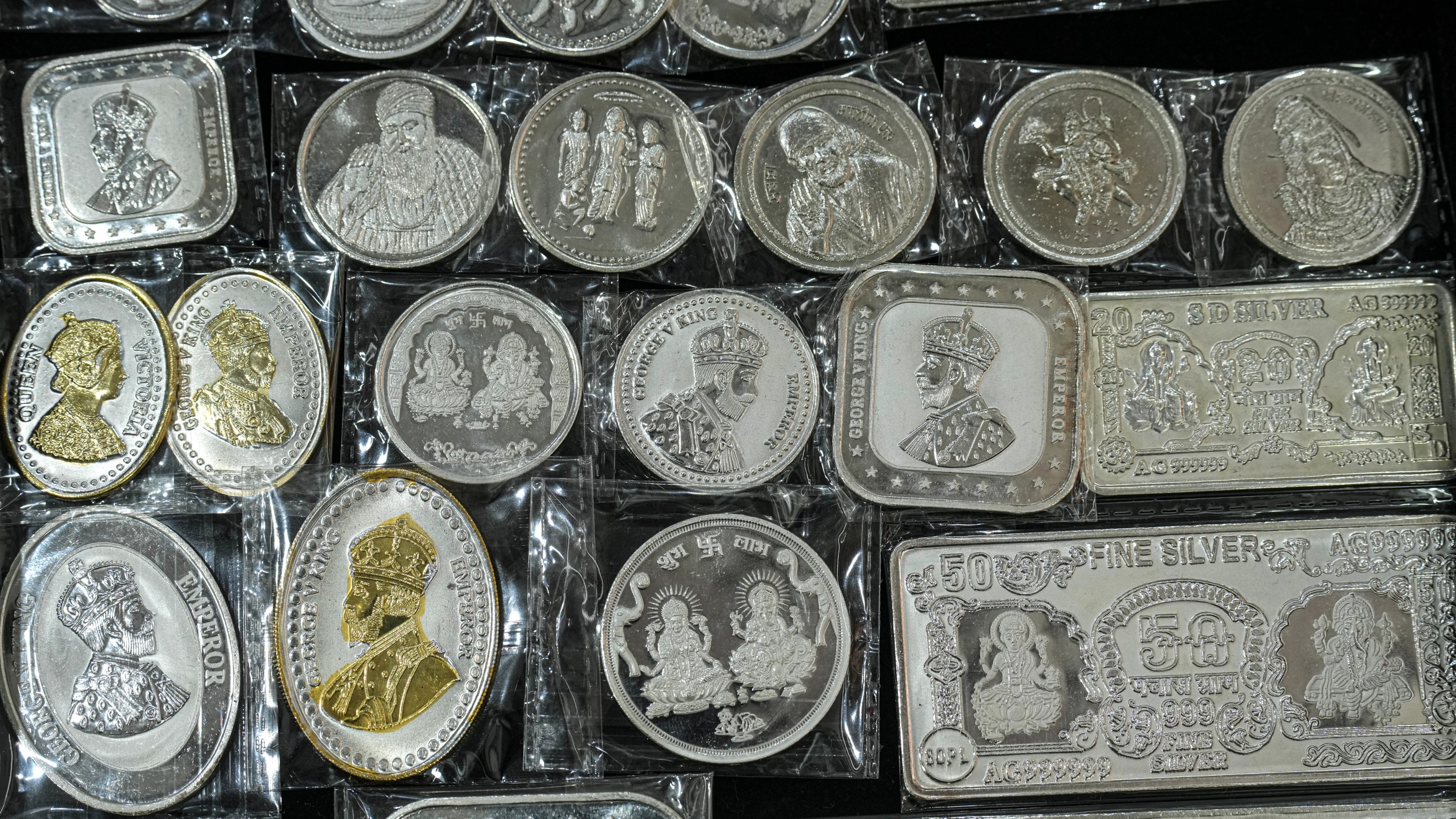 Silver pulls back after record surge on weak global cues, profit taking
