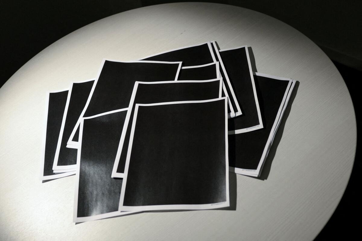 Newly-released documents from disgraced late financier and sex offender Jeffrey Epstein, including a sheaf of entirely redacted pages, are seen in this handouts released by the U.S. Justice Department and printed and arranged for a photograph by Reuters in Washington, D.C., U.S.