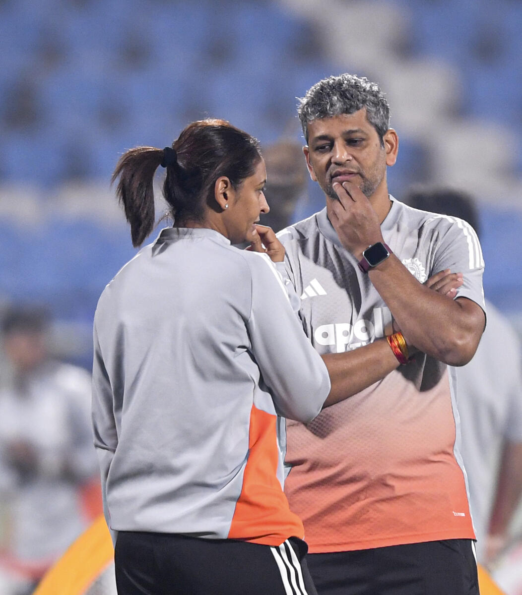 India's captain Harmanpreet Kaur with head coach Amol Muzumdar during a training session ahead of the first T20I cricket match between India Women and Sri Lanka Women.