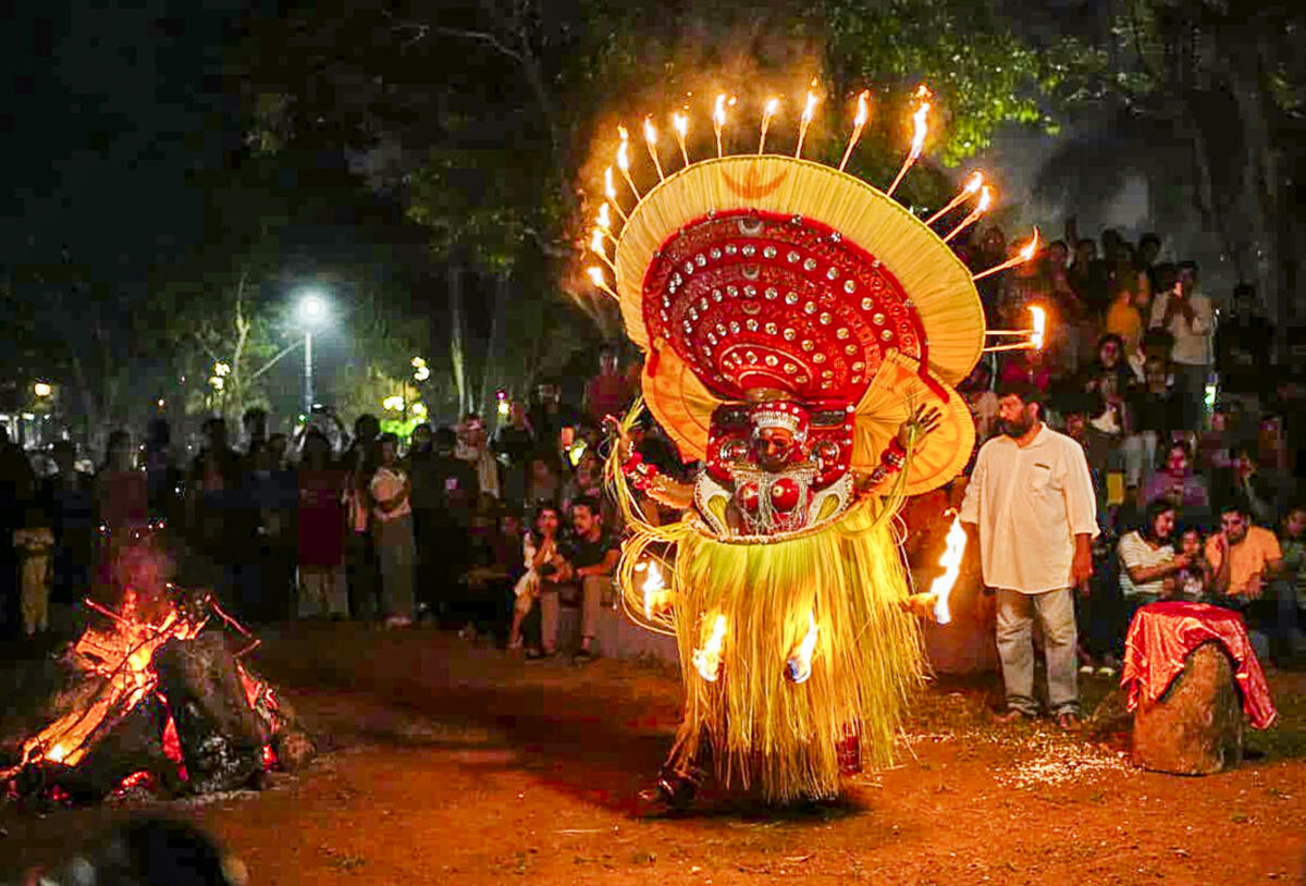 An artist performs 'Bhagavathy Theyyam' as part of the Indian Cultural Congress event, in Kochi.