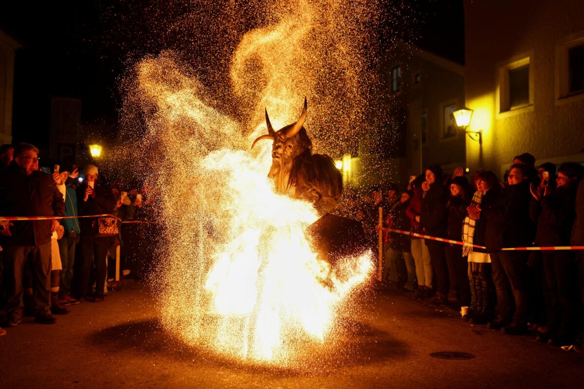 A performer in a costume participates in the traditional Rauhnacht run during the "The Twelve Nights of Christmas" in the Bavarian town of Beilngries, north of Ingolstadt, Germany.