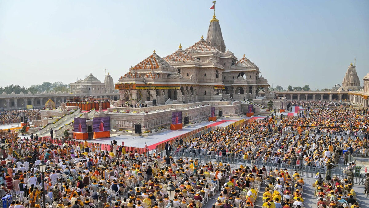 People attend the ‘Dhwajarohan’ ceremony at the Ram Temple, in Ayodhya, Uttar Pradesh.