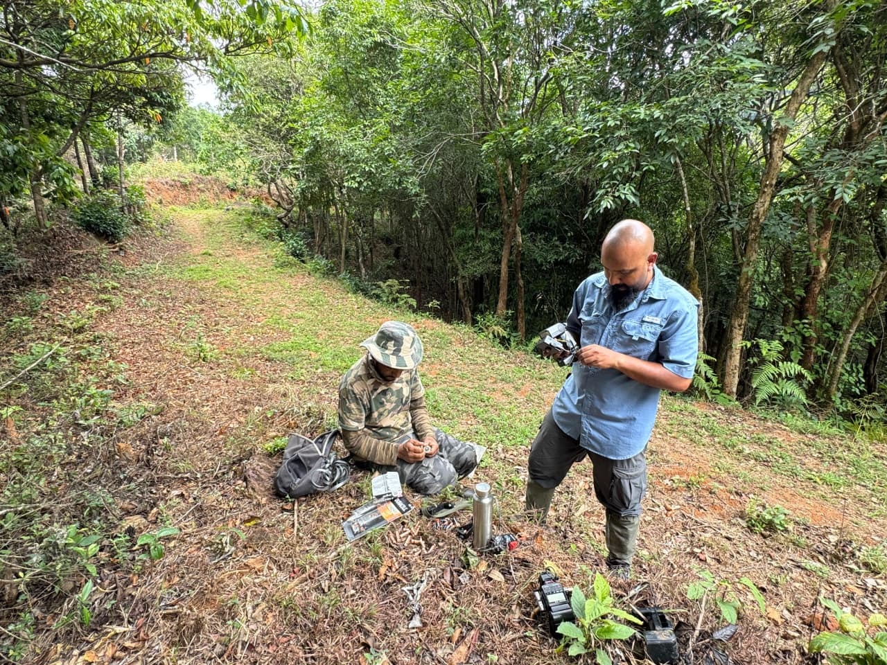 Pruthvi B setting up a camera trap. Photos by Pruthvi B