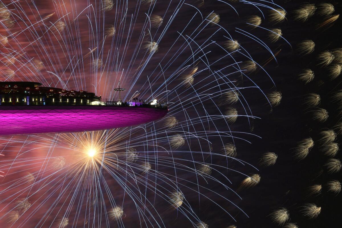 People watch New Year’s Day celebration fireworks from the Marina Bay Sands hotel in Singapore January 1, 2026