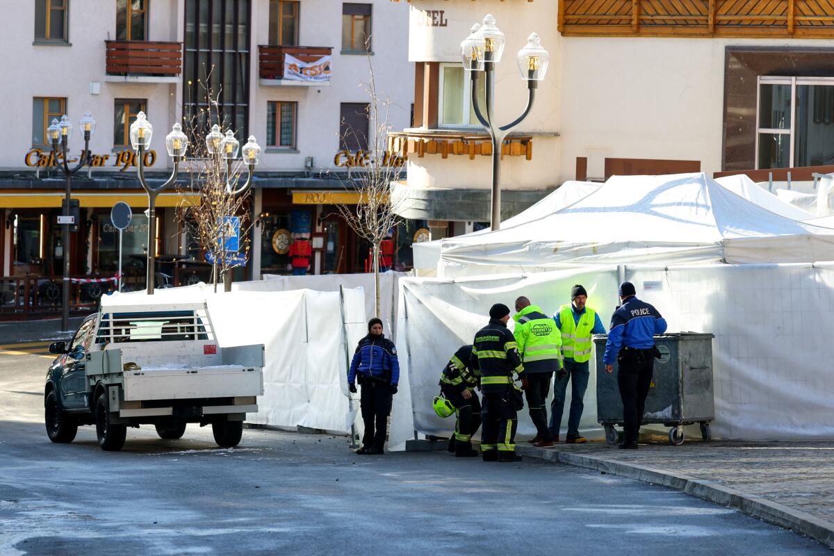 Emergency personnel work at the site of an explosion and fire at the "Le Constellation" bar, where several people died and others were injured after an explosion tore through a crowded New Year’s Eve party, according to Swiss police, in the upscale ski resort of Crans-Montana in southwestern Switzerland, January 1, 2026.