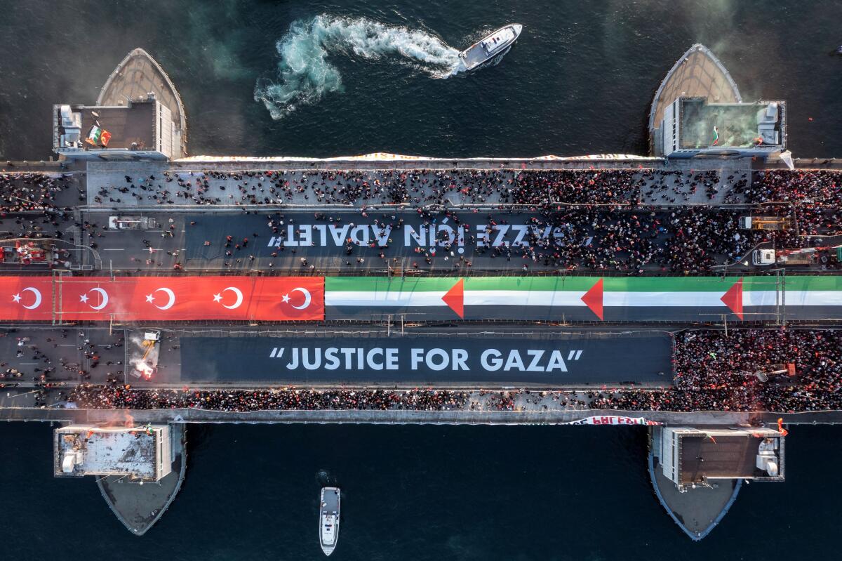 A drone view shows people gathering over the Galata Bridge in solidarity with Palestinians on New Year's Day in Istanbul, Turkey, January 1, 2026.