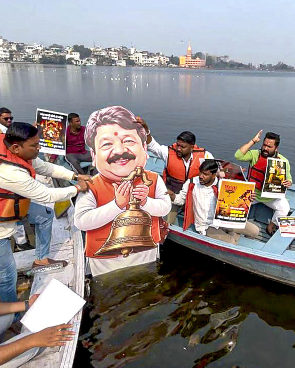 Youth Congress activists protest against Minister of Parliamentary Affairs of Madhya Pradesh Kailash Vijayvargiya over Indore water contamination deaths, at Lower Lake, in Bhopal, Friday, Jan. 2, 2026.