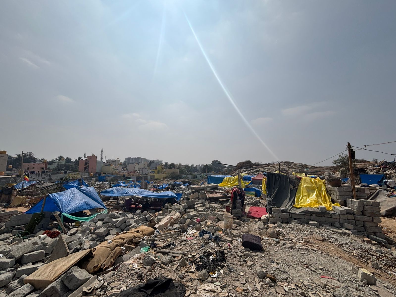With their homes demolished residents continue to live in makeshift tents amid the rubble. DH PHOTO/NAVEEN MENEZES