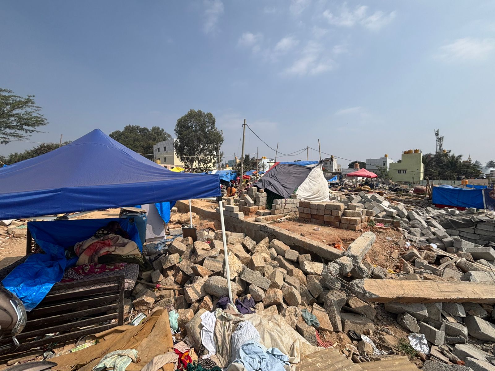 With their homes demolished residents continue to live in makeshift tents amid the rubble. DH PHOTO/NAVEEN MENEZES