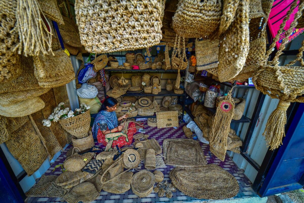 An artisan crafts decorative and utility items from banana fibre at Anegundi. Photo/Bharat Kandakur