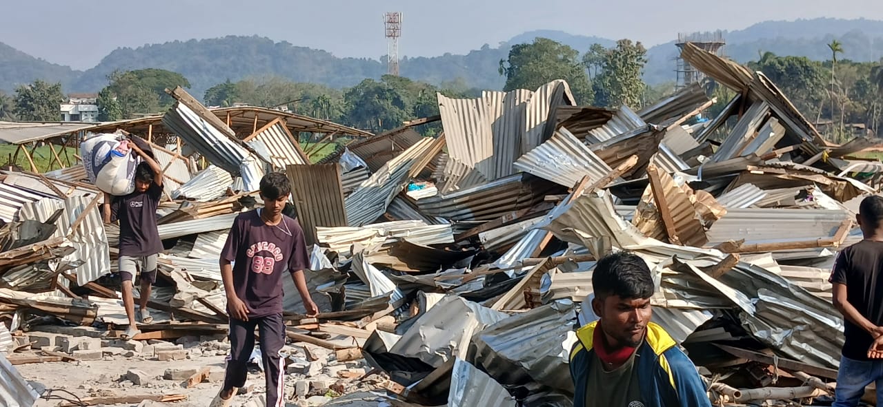People looking for missed belongings in the ruins of the demolished houses.