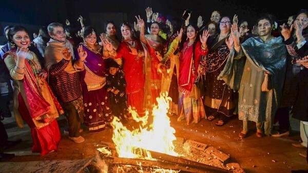 Members of the Sikh community celebrate 'Lohri' festival, in Patna.