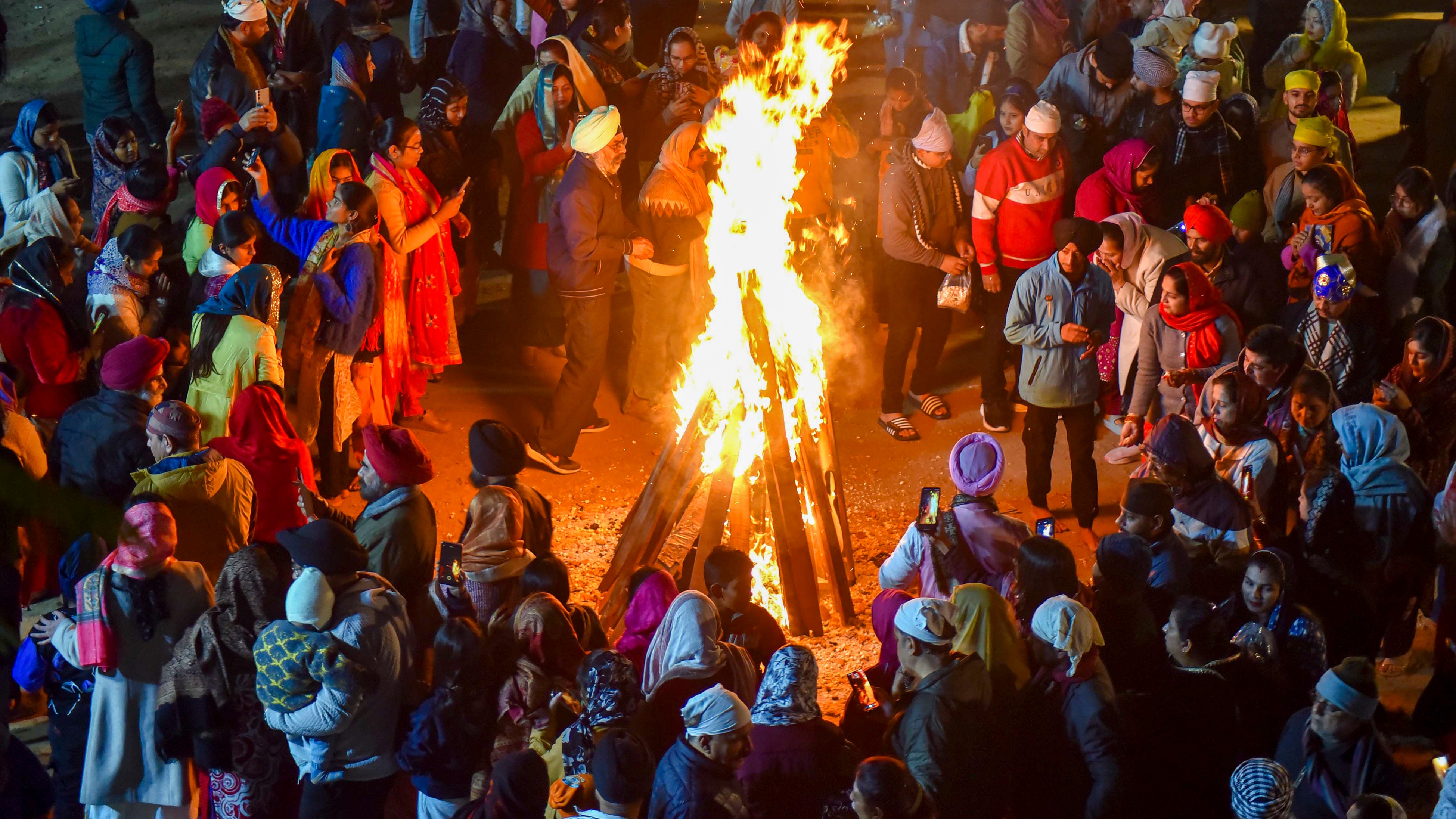 Lohri celebrated with traditional rituals and gaiety; See Pics