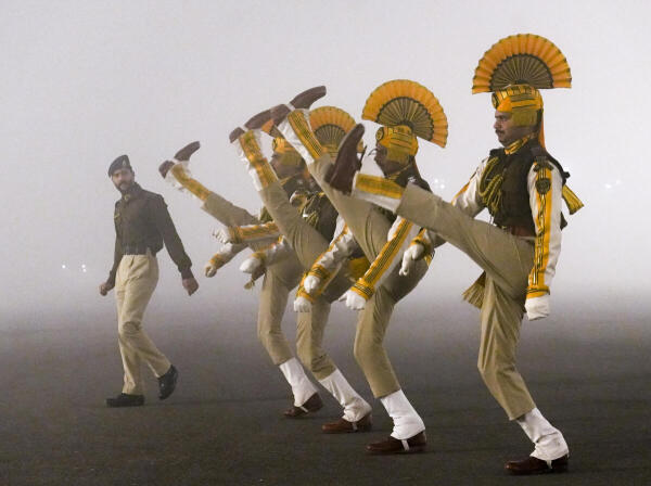 Central Industrial Security Force (CISF) personnel during rehearsals amid dense fog on a cold winter morning, ahead of the Republic Day Parade, in New Delhi.