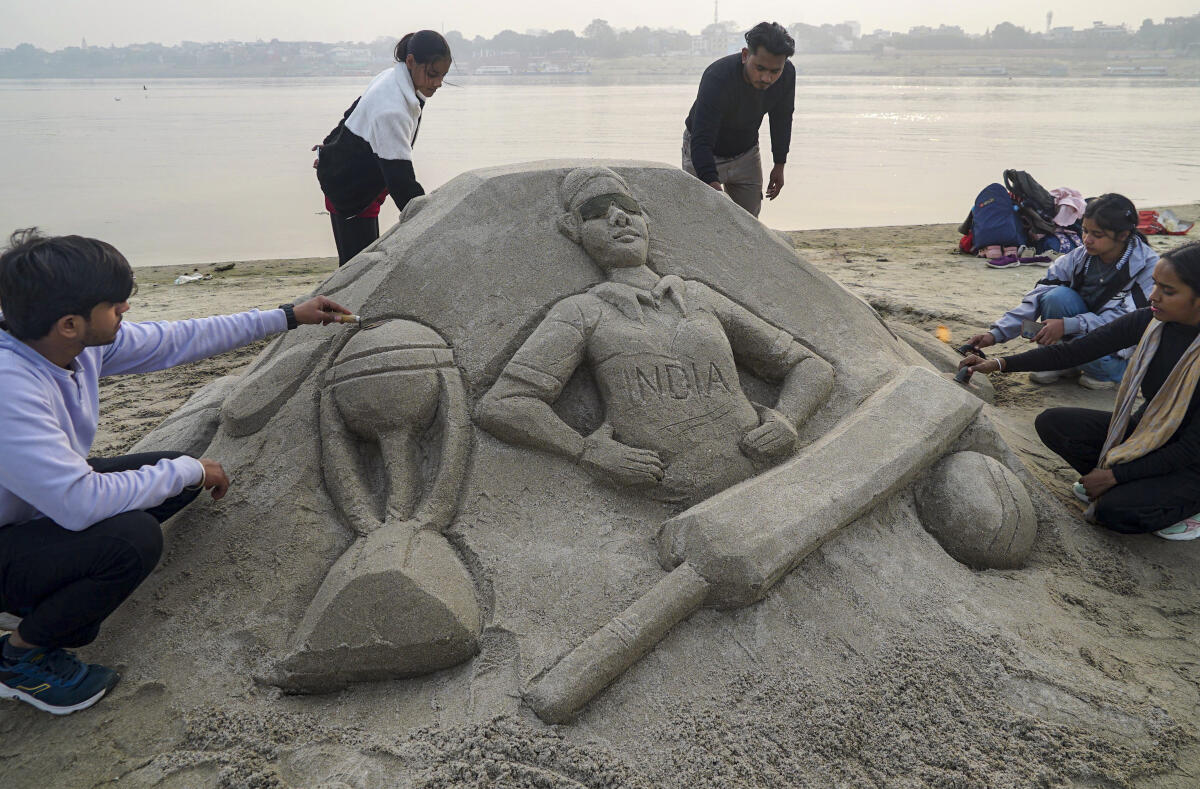 Artists create a sand sculpture depicting the Cricket World Cup during the 24th annual ‘Sandcraft’ event on the banks of the Ganga river, in Varanasi. PTI