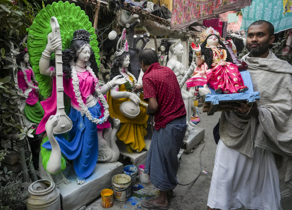 Preparations ahead of the 'Saraswati Puja' festival, at Kumartuli, in Kolkata. PTI
