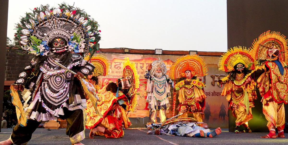Artists perform the 'Purulia Chhau' dance depicting ‘Duryodhan Vadh’ during an event titled 'Mahabharat', in Bhopal. PTI