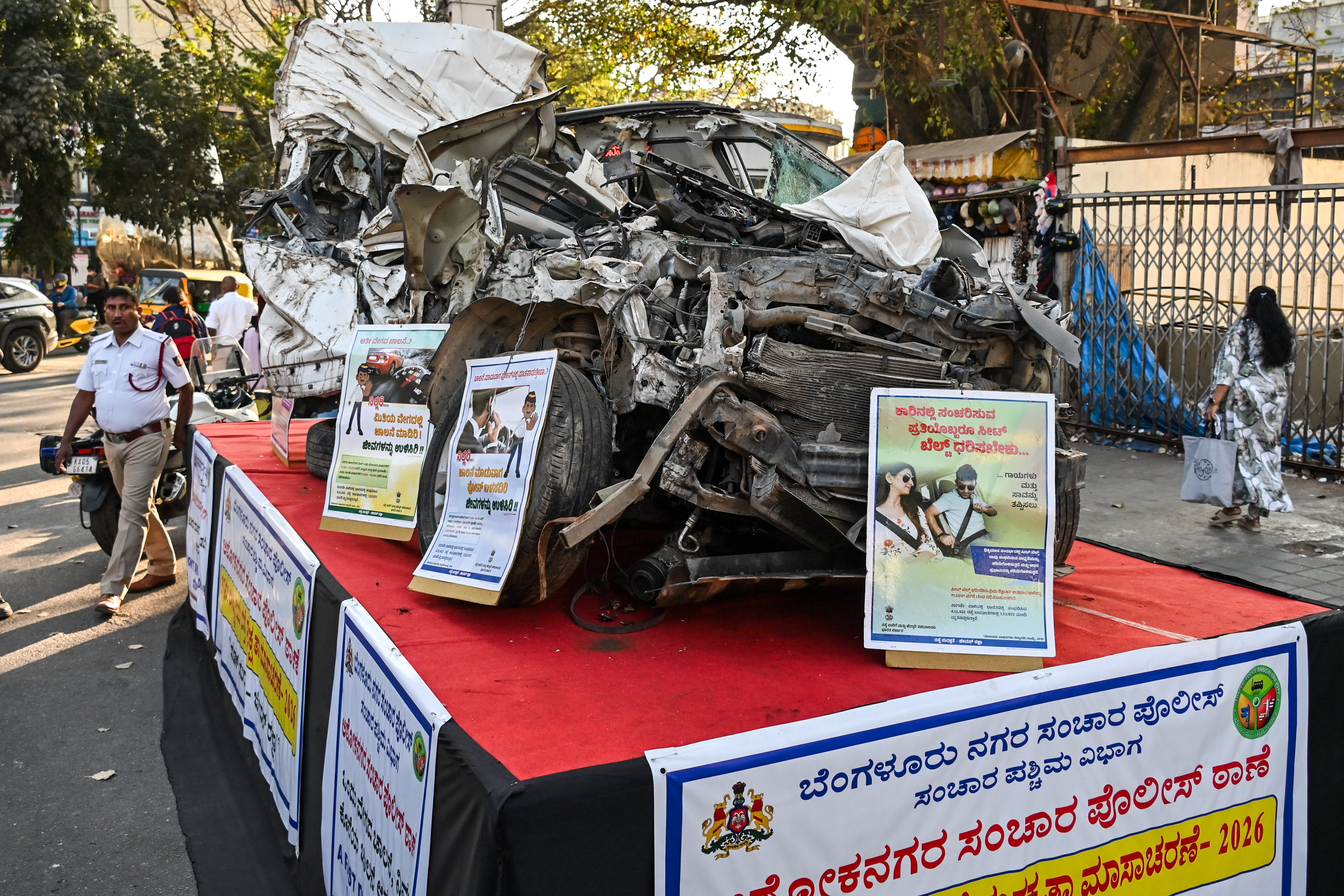 A wrecked car displayed at the Brigade Road–Residency Road Junction on Thursday serves as a stark reminder of the dangers of drunk driving. DH PHOTO/PUSHKAR V