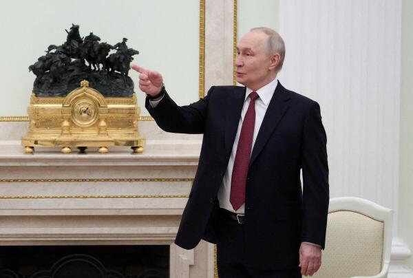Russian President Vladimir Putin gestures during a meeting with Palestinian President Mahmoud Abbas at the Kremlin in Moscow, Russia.