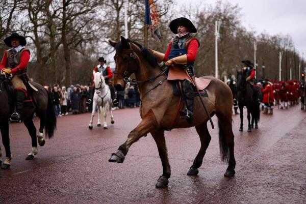 Historical reenactors from the King's Army branch of the English Civil War Society march on horseback along The Mall to mark King Charles I's execution in 1649, in London, Britain.