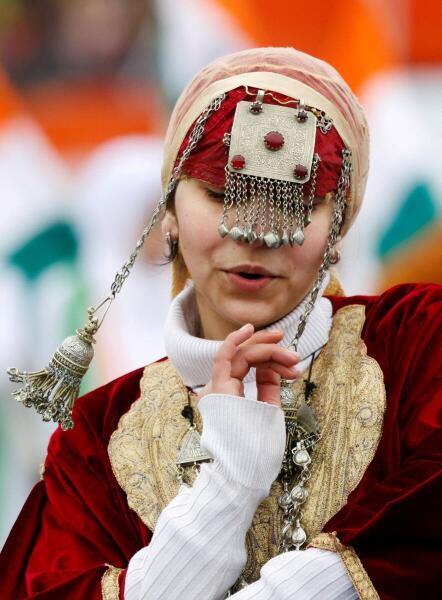 A school student perform during a Kashmiri traditional song amidst Republic Day celebrations in Srinagar.