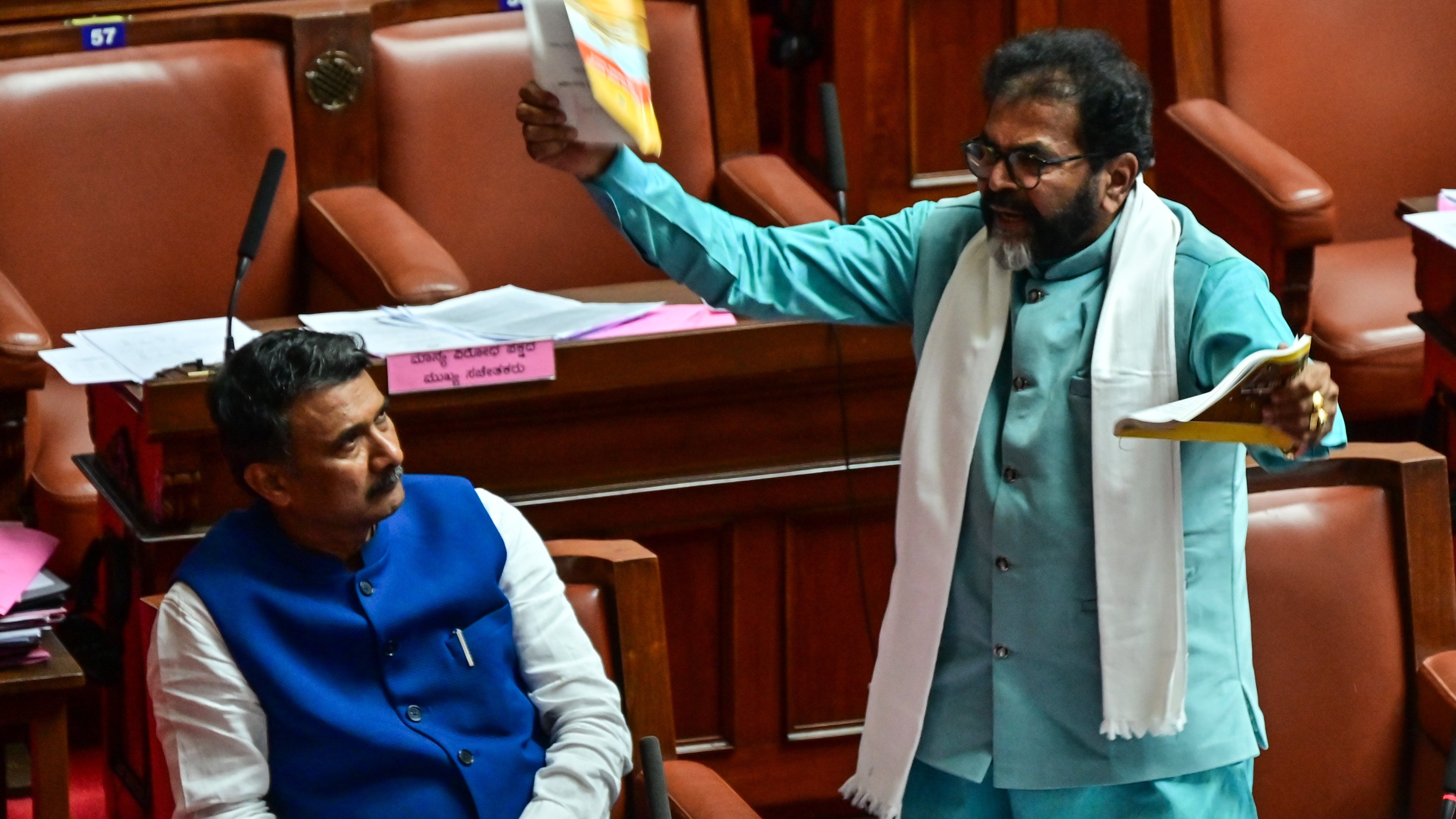 Opposition leader Chalavadi Narayanaswamy tears Rule Book; Karnataka Legislative Council plunges into chaos