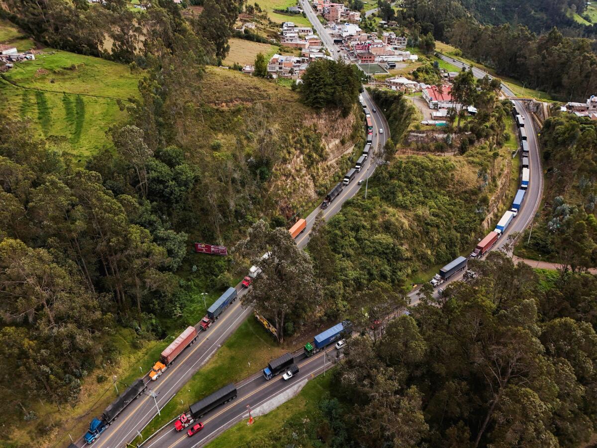A drone view shows trucks lining up at the Ecuador-Colombia border as traffic builds ahead of new tariffs announced by Ecuadorean President Daniel Noboa and Colombian President Gustavo Petro, in Ipiales, Colombia.